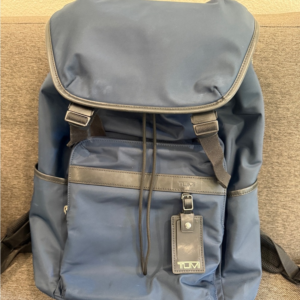 Tumi Blue Backpack with Adjustable Straps and Minimalist Design
